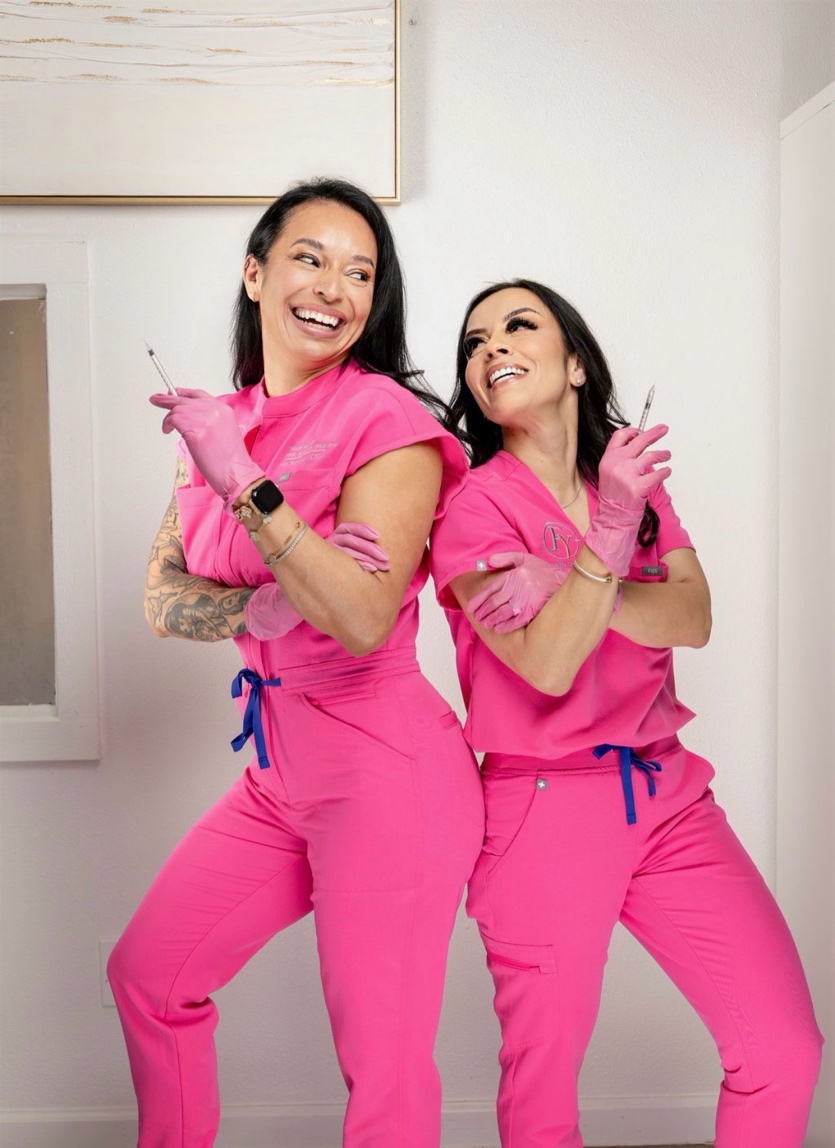 Lynda and Maria in their signature pink scrubs